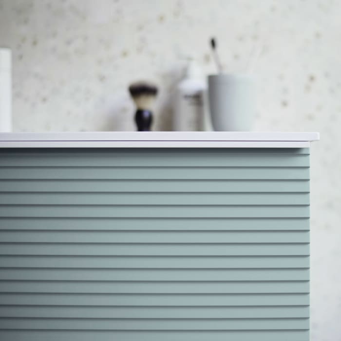 burgbad Fiumo Mineralguss-Waschtisch mit Unterschrank 62 cm, mit Griff G0223, oben mit Plissée-Struktur