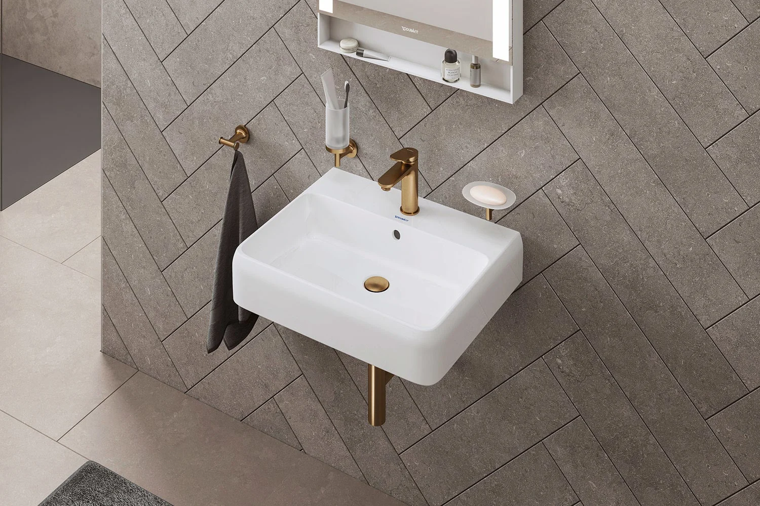 Biała umywalka ze złotymi armaturami, Duravit