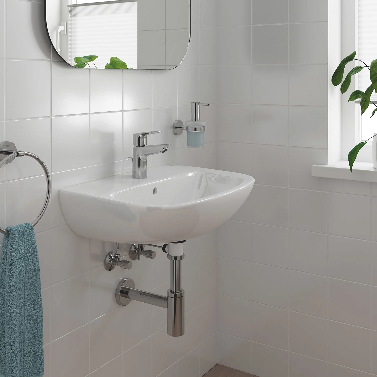 Zbliżenie umywalki z baterią i ręcznikiem, Grohe