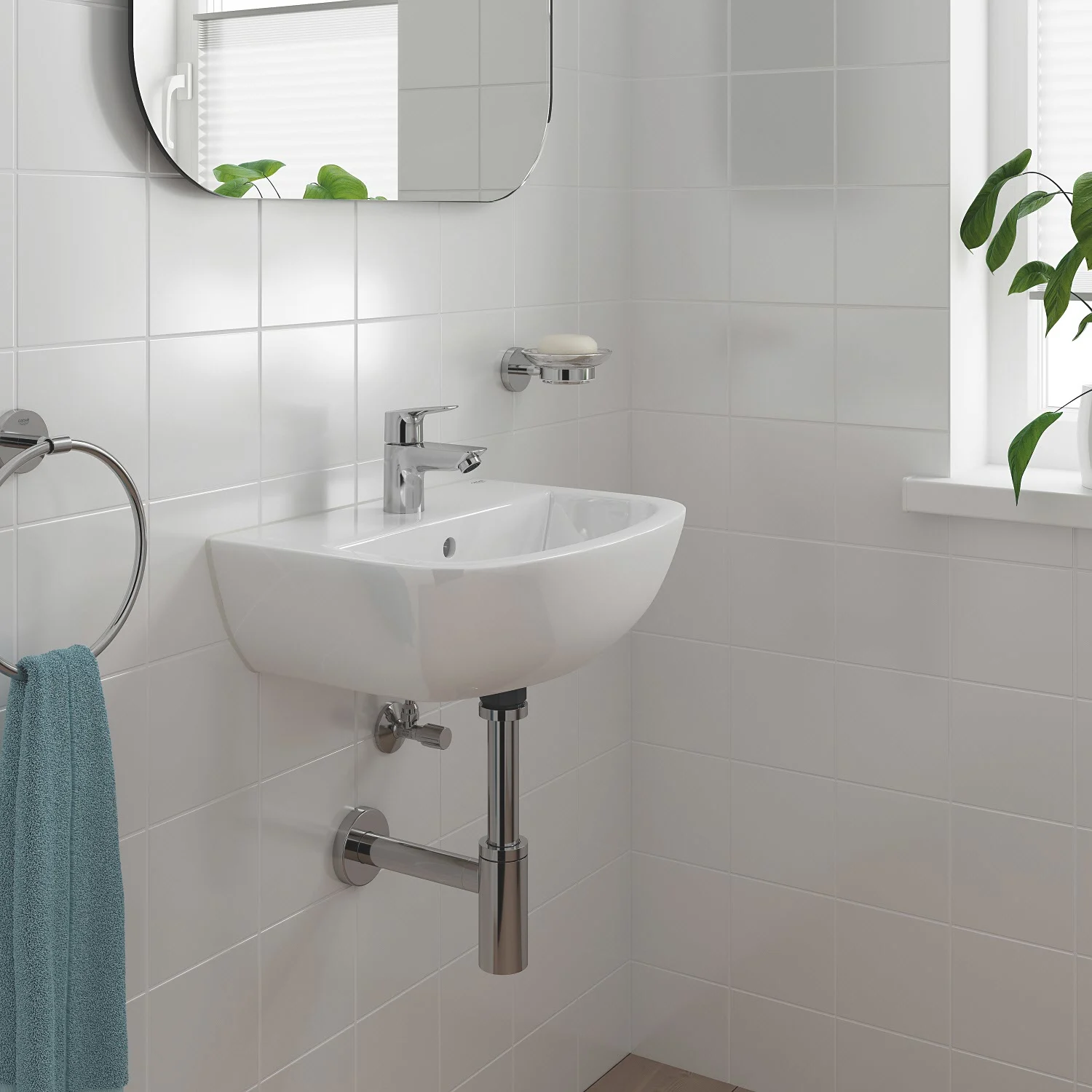 Mała umywalka z chromowaną baterią w łazience, Grohe