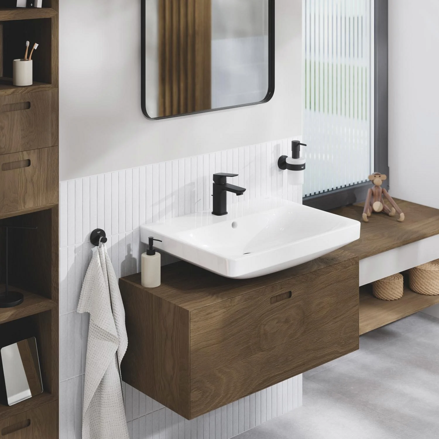 Umywalka z czarną baterią w łazience, Grohe