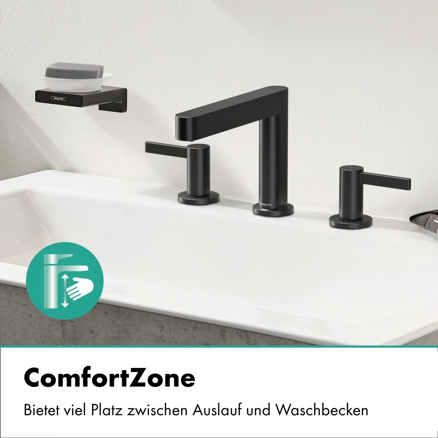 Czarna bateria trzyotworowa na białej umywalce, hansgrohe