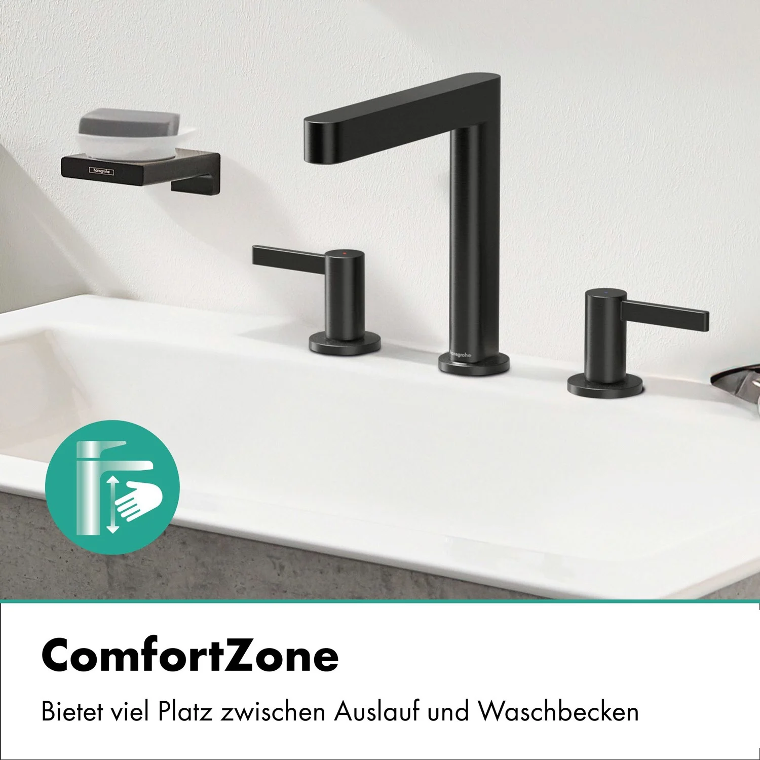 Czarna bateria trzyotworowa na białej umywalce, hansgrohe