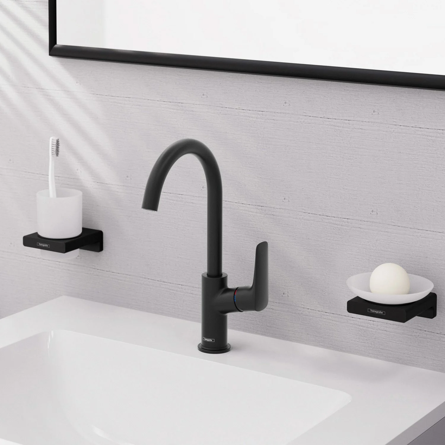 Czarna bateria umywalkowa z akcesoriami w łazience, hansgrohe