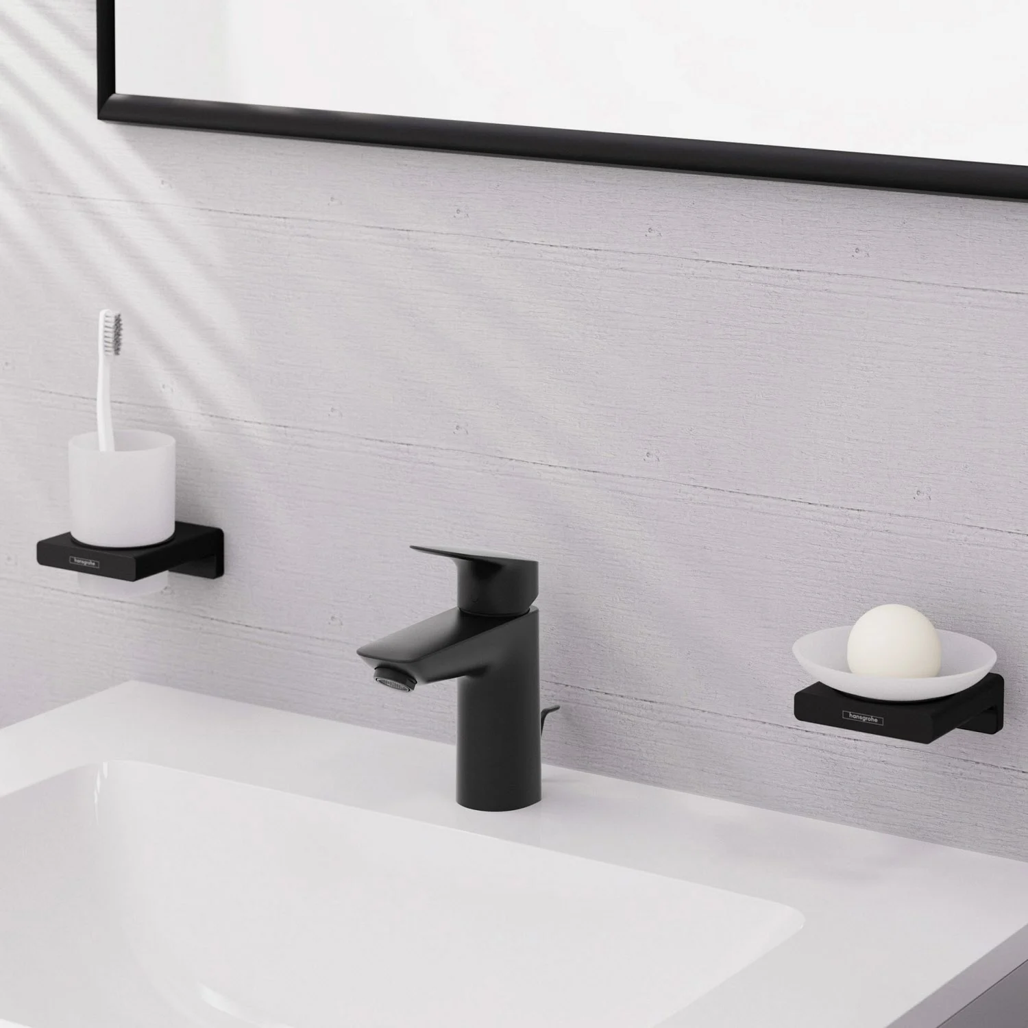 Czarna bateria umywalkowa z akcesoriami w łazience, hansgrohe