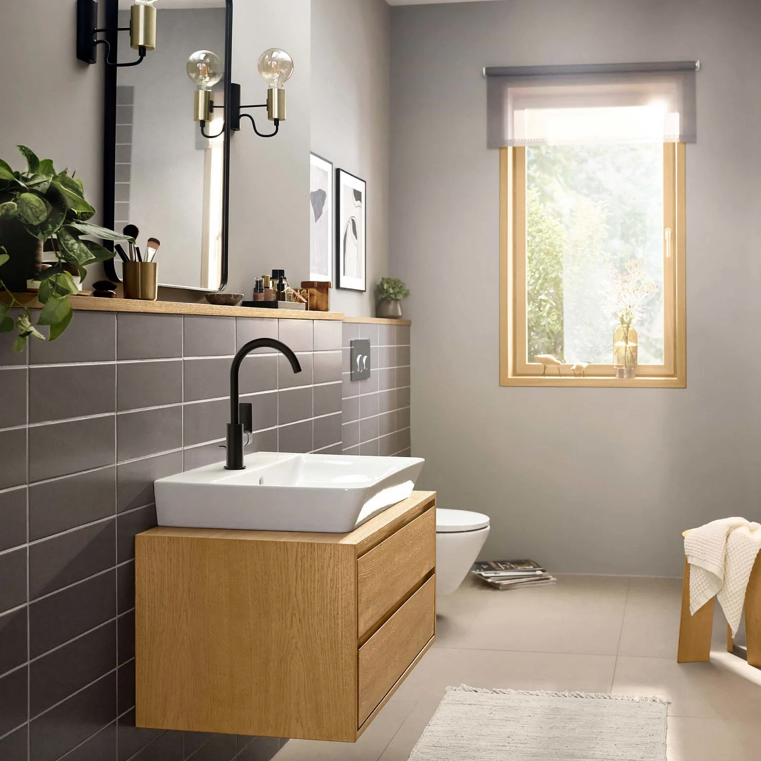 Umywalka z ciemną baterią w łazience, hansgrohe