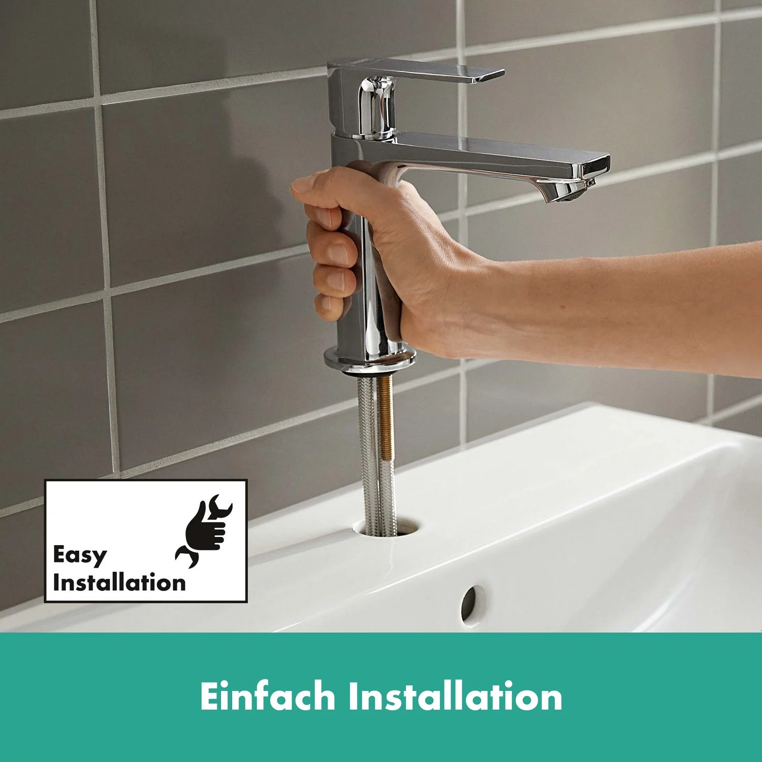Ręka instalująca baterię umywalkową w łazience, hansgrohe