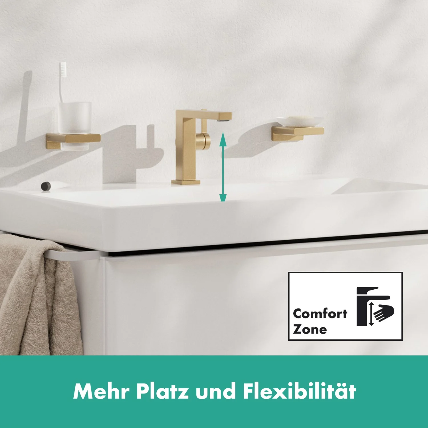 Złota bateria umywalkowa z ręcznikiem i symbolem, hansgrohe