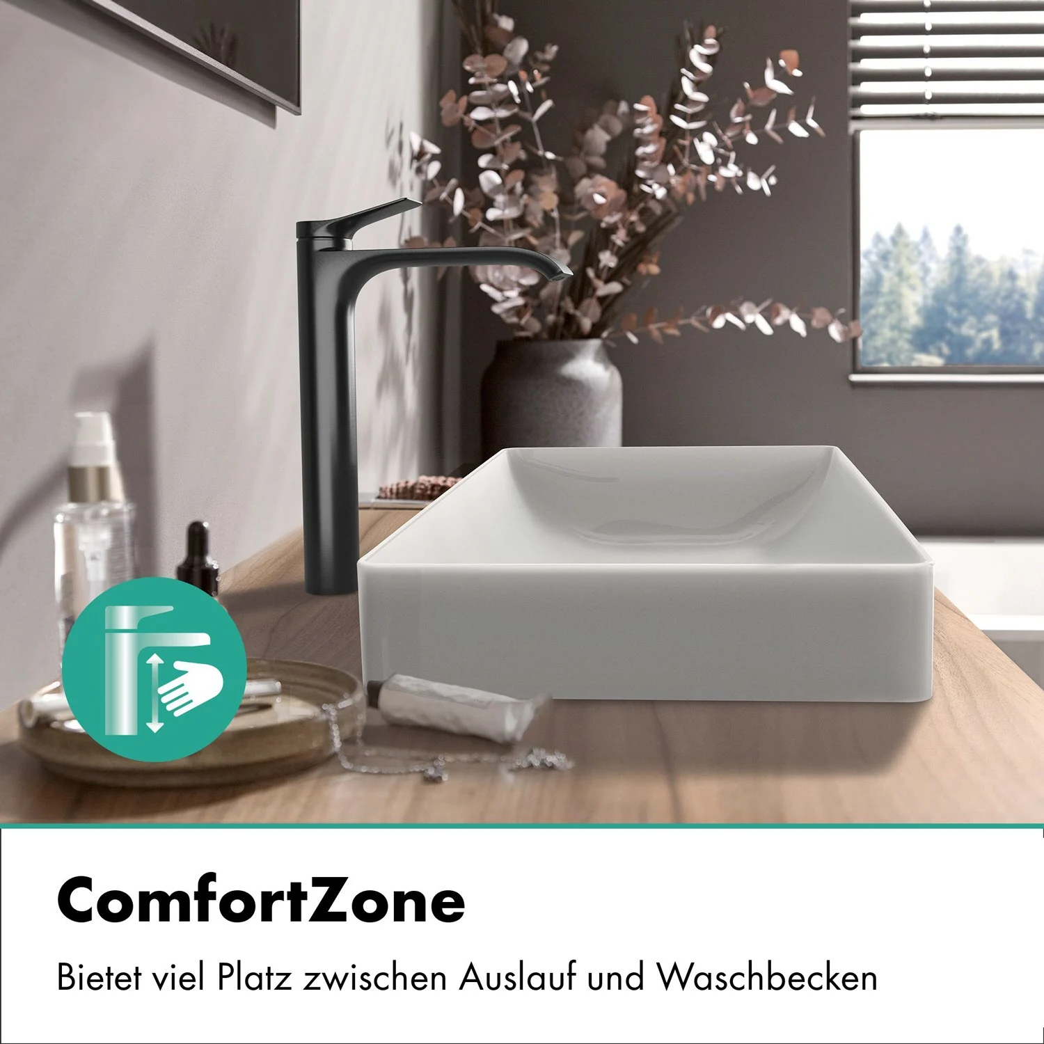 Czarny kran obok umywalki w łazience, hansgrohe
