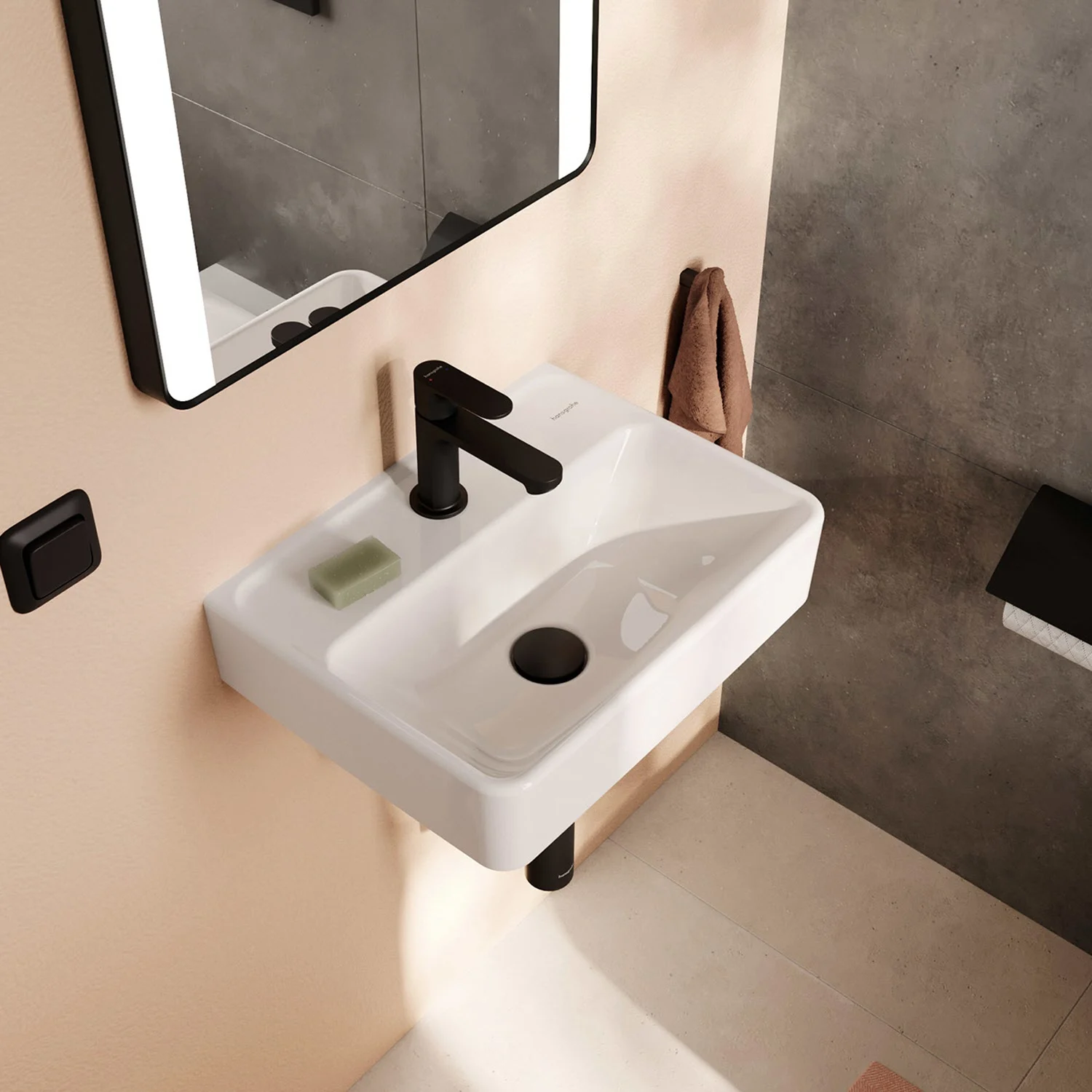 Biała umywalka z czarną baterią w łazience, hansgrohe
