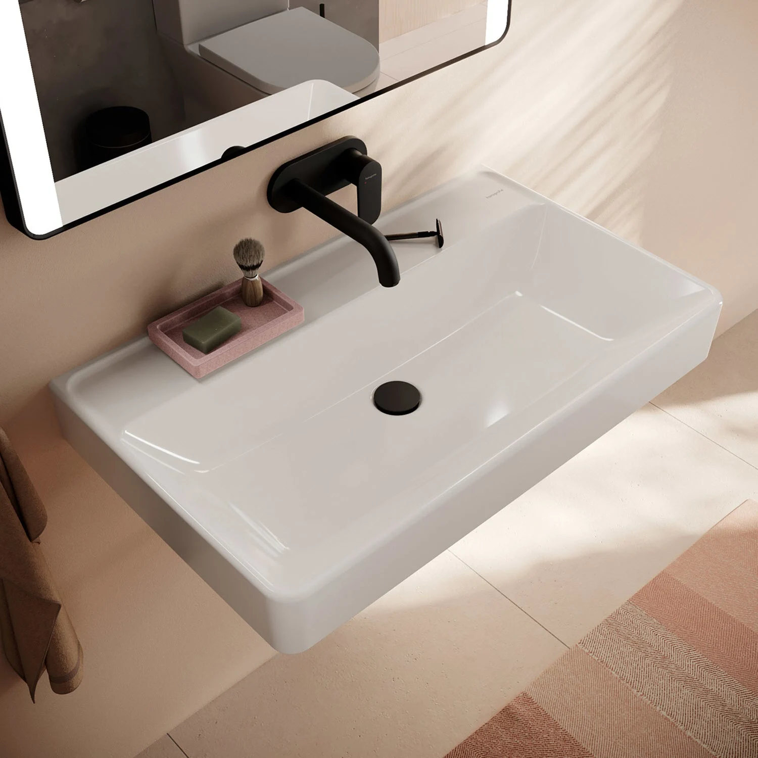 Biała umywalka z czarną baterią w łazience, hansgrohe