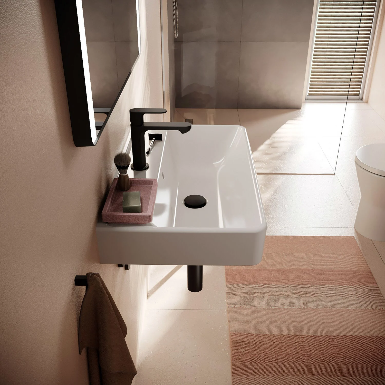 Kompaktowa umywalka z czarną baterią w łazience, hansgrohe