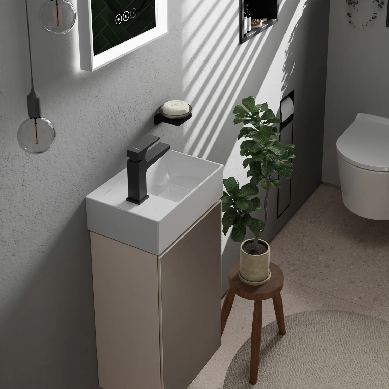 Kompaktowa umywalka z czarną armaturą w łazience, hansgrohe