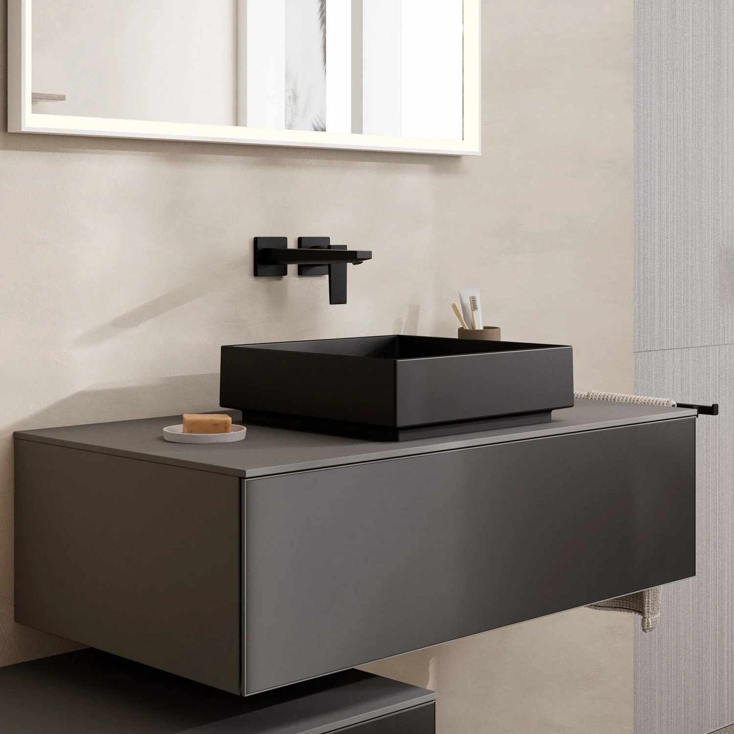 Czarna umywalka na szarej toaletce w łazience, hansgrohe