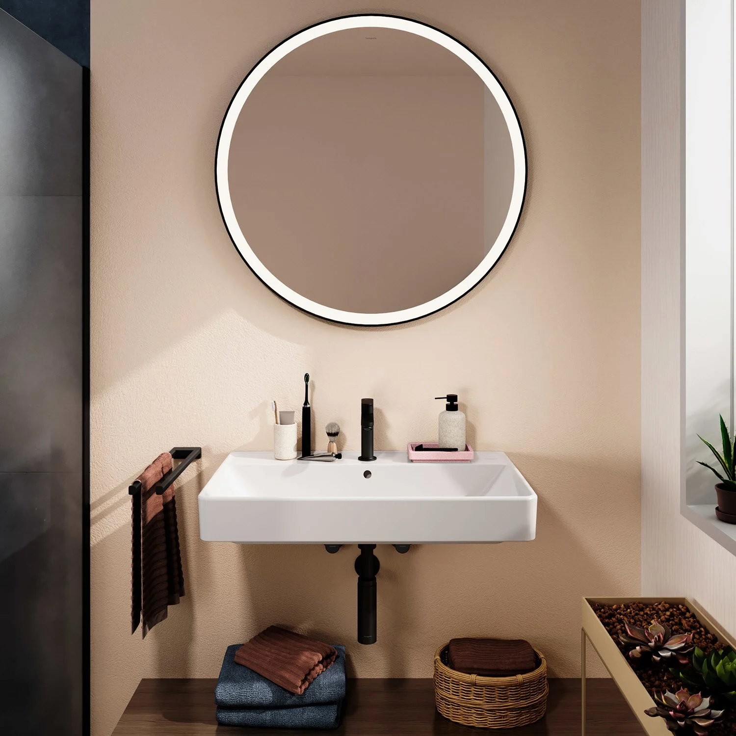Okrągłe lustro nad umywalką w łazience, hansgrohe