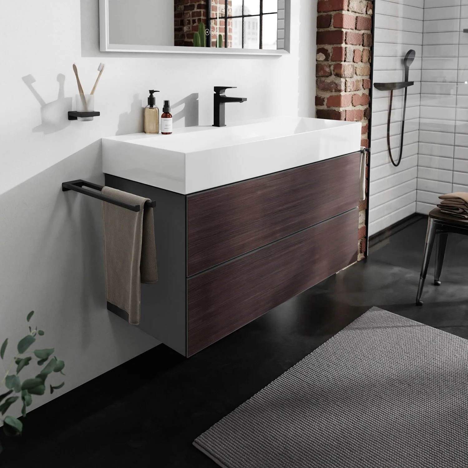 Ciemna szafka pod umywalkę w nowoczesnej łazience, hansgrohe