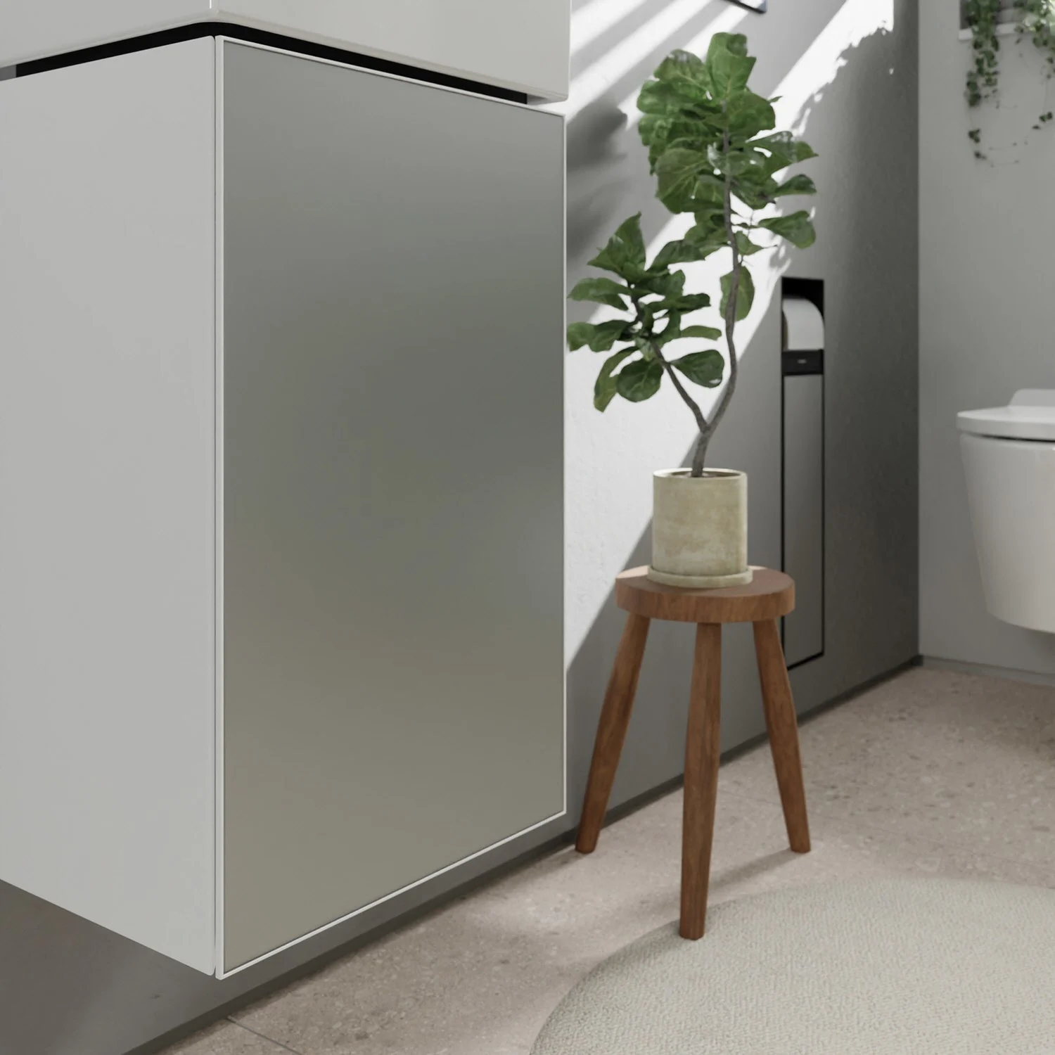 Szara szafka pod umywalkę z rośliną w łazience, hansgrohe
