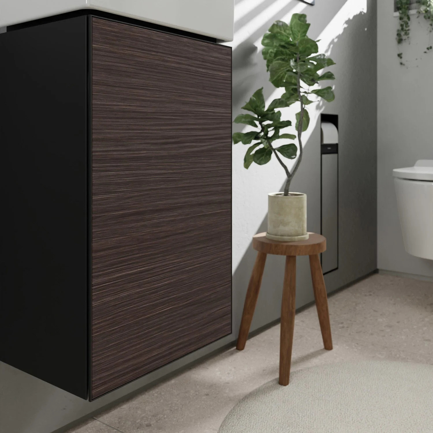 Ciemna szafka pod umywalkę z rośliną w łazience, hansgrohe