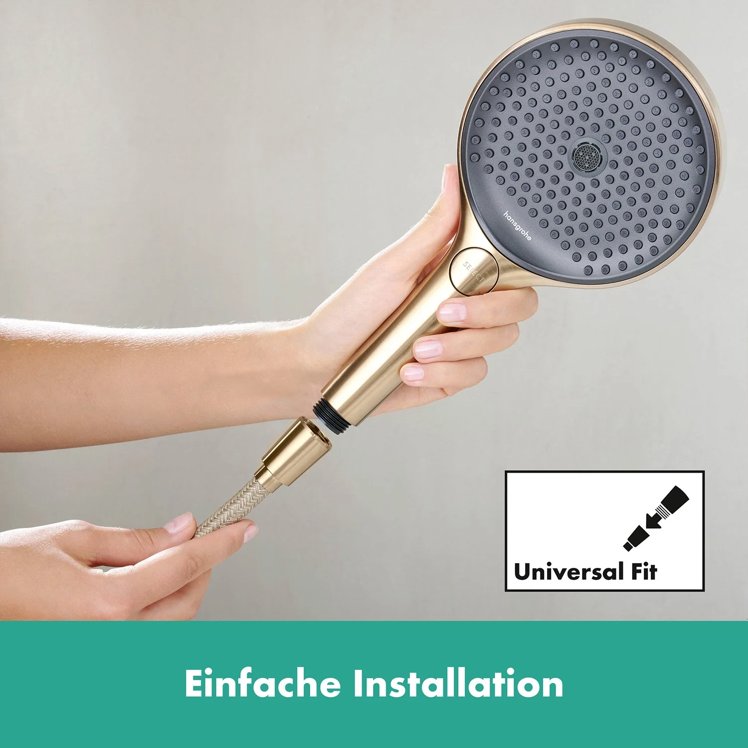 Słuchawka prysznicowa ze złotym wężem zbliżenie, hansgrohe