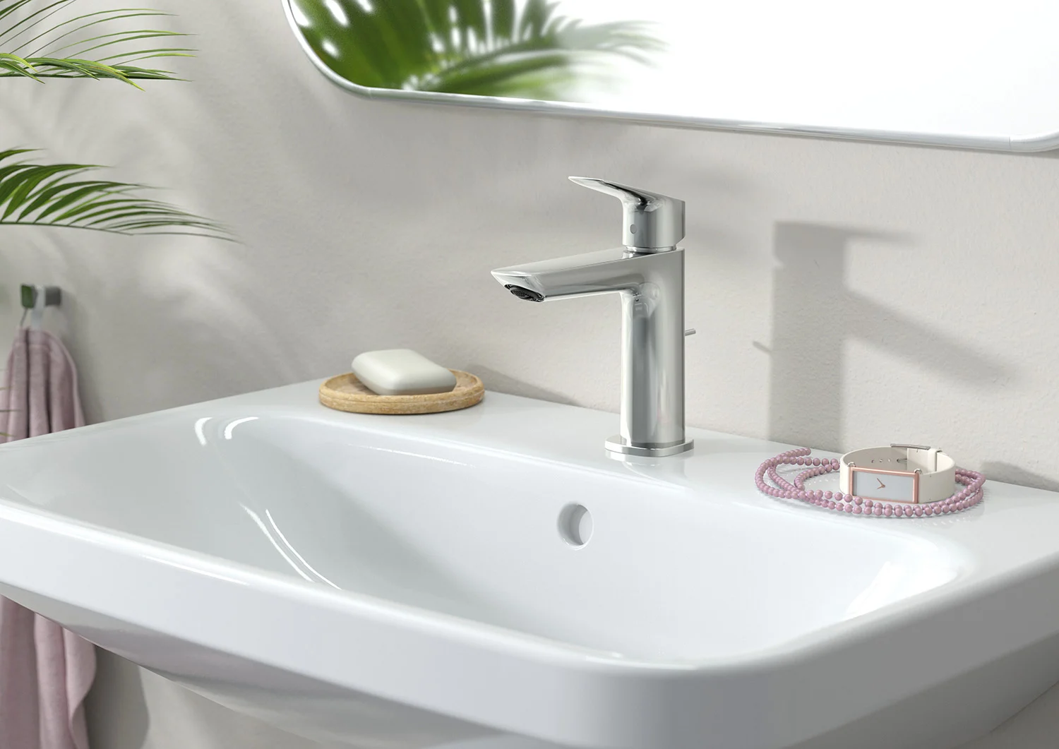 Srebrna bateria umywalkowa z mydelniczką w łazience, hansgrohe