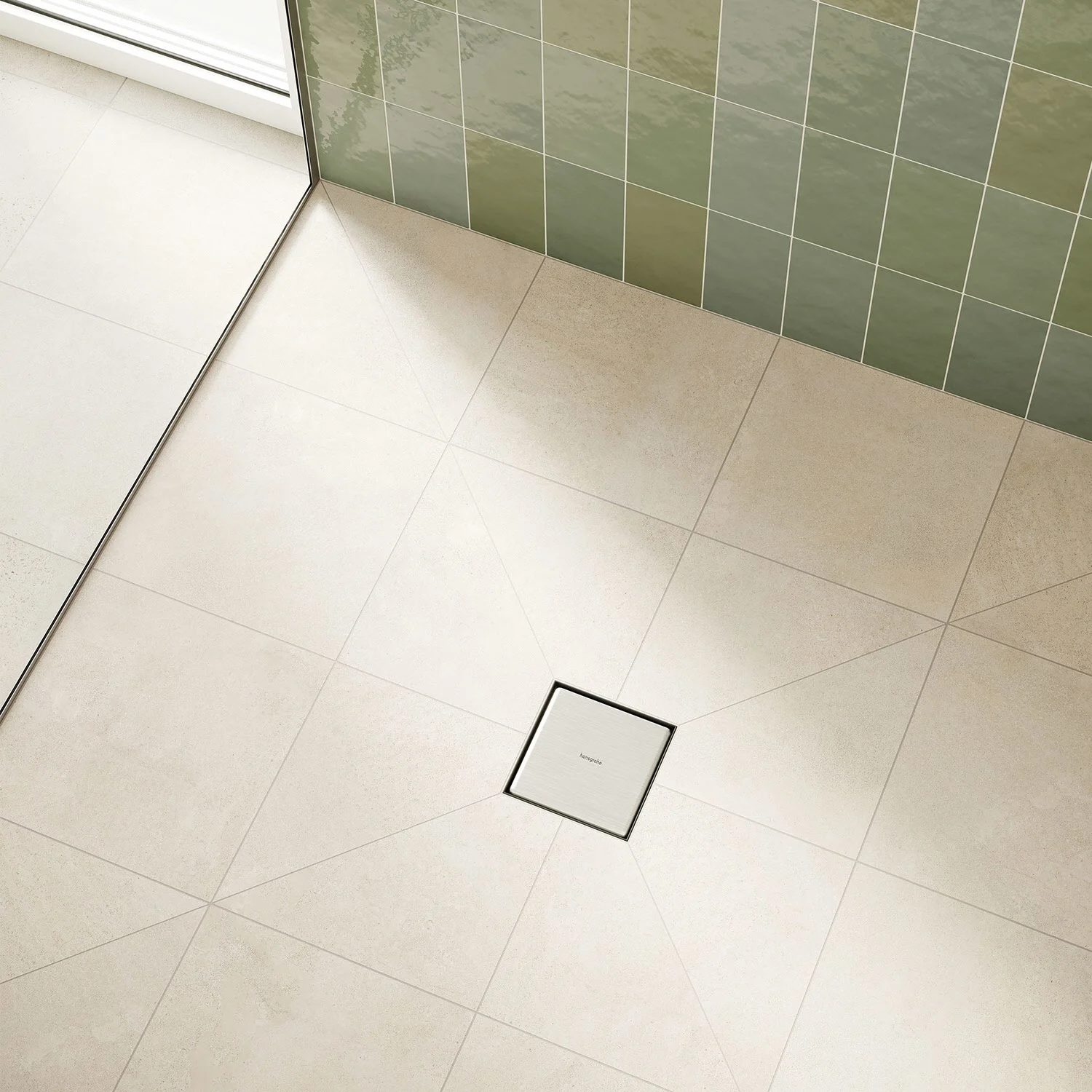 Odpływ podłogowy w kafelkowym prysznicu z zielonymi płytkami, hansgrohe