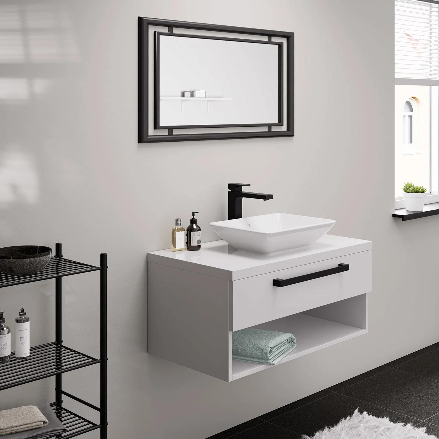 Zbliżenie umywalki z czarną baterią, hansgrohe