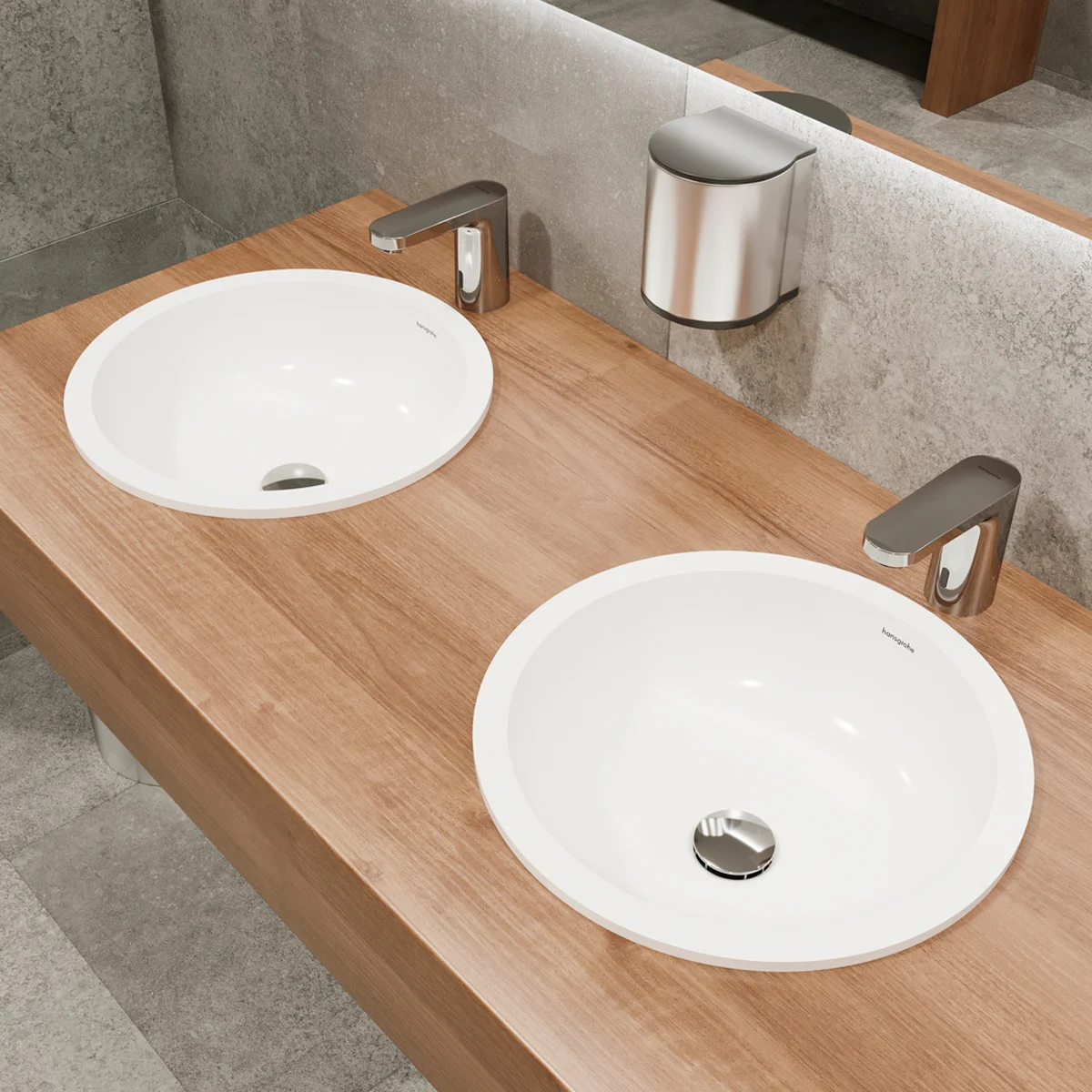 Dwie okrągłe umywalki z kranami, hansgrohe