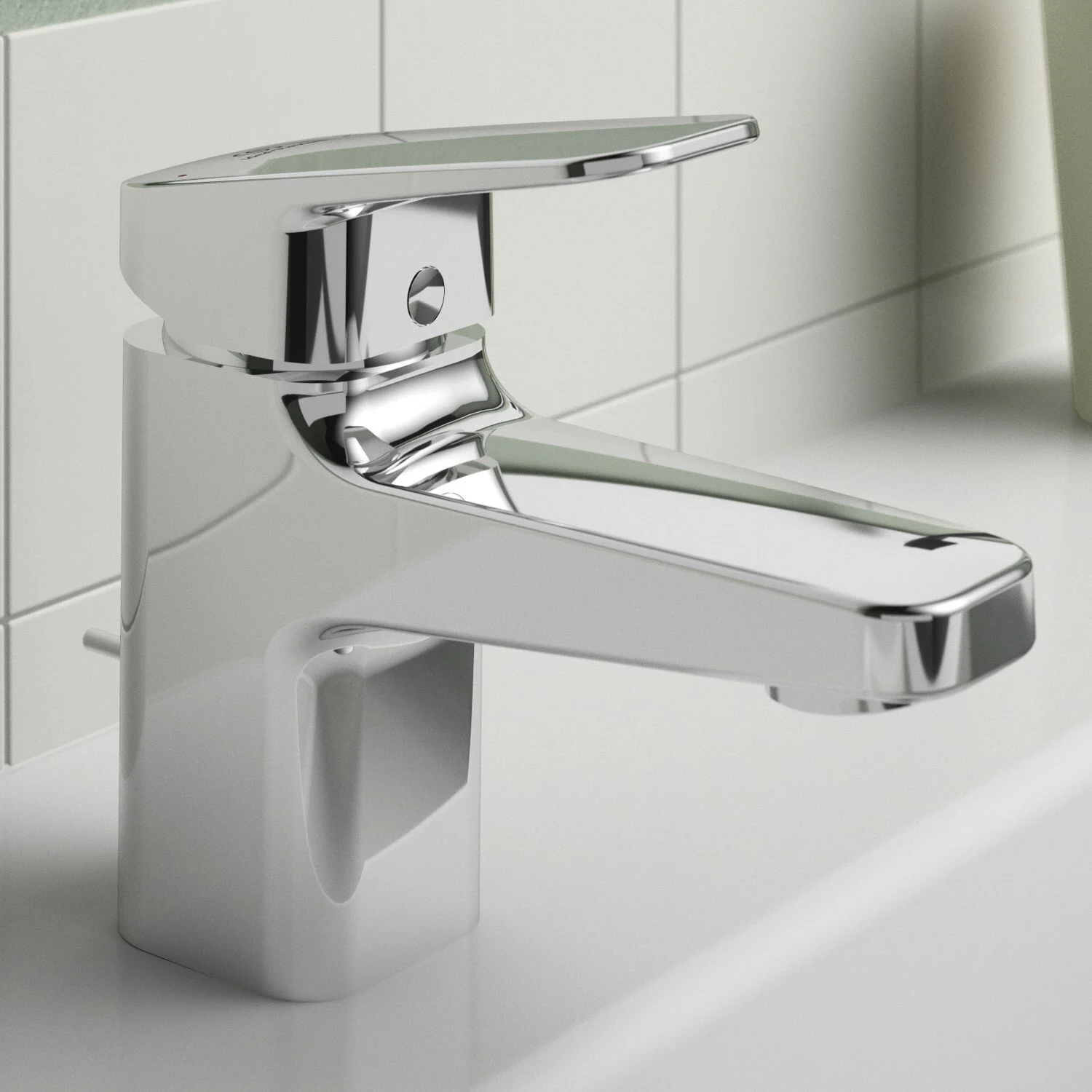 Chromowana bateria umywalkowa na białej umywalce, Ideal Standard