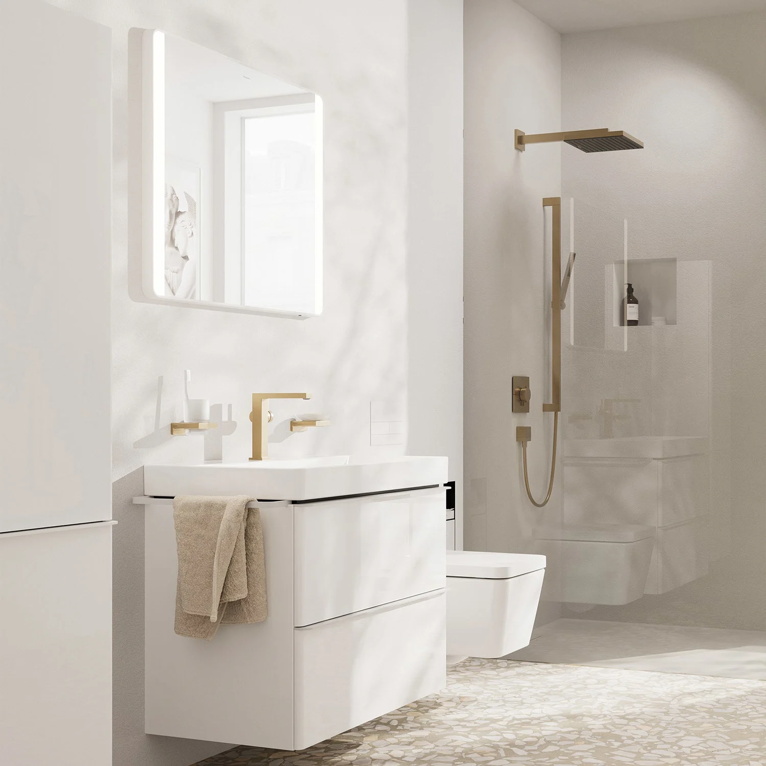 Nowoczesna łazienka z białymi meblami i złotymi armaturami, hansgrohe