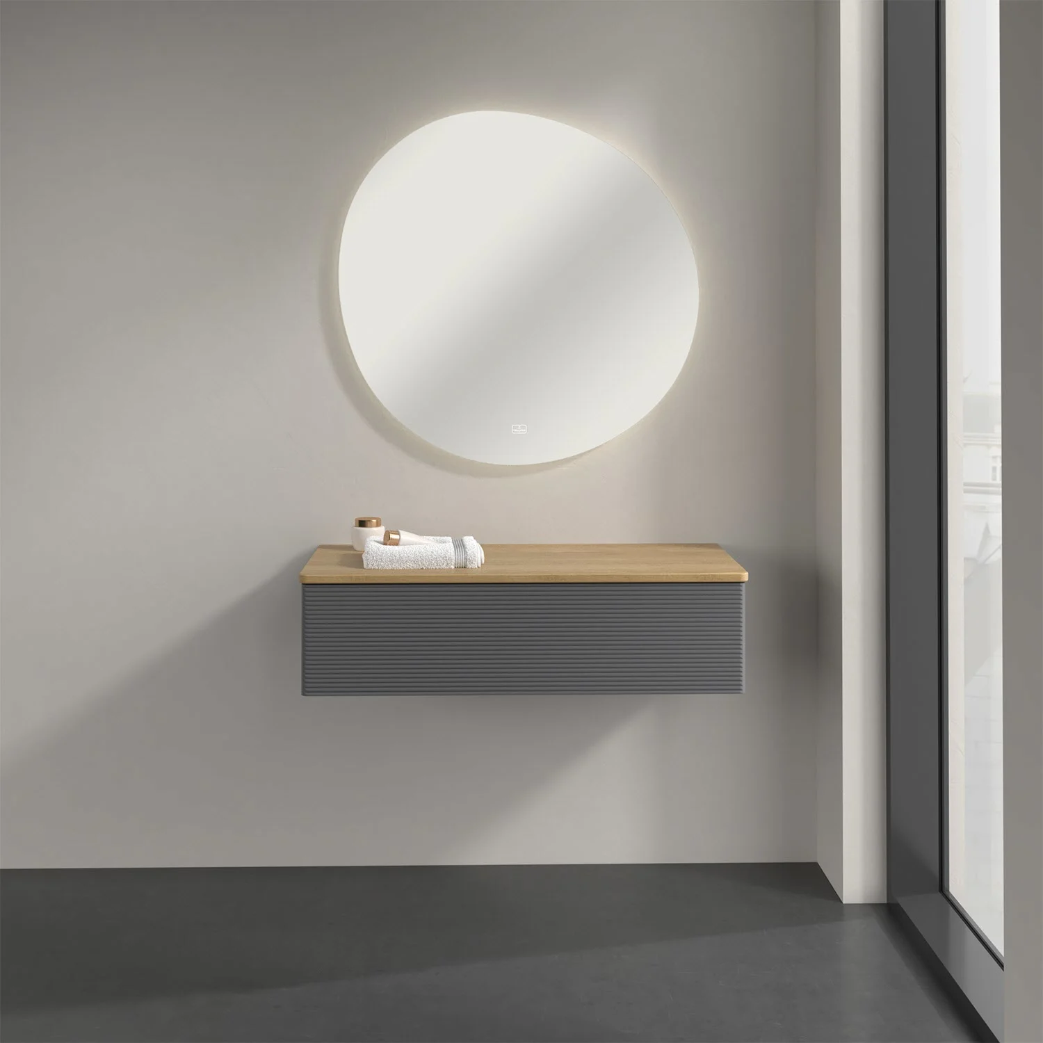 Okrągłe lustro z szarą umywalką, Villeroy & Boch