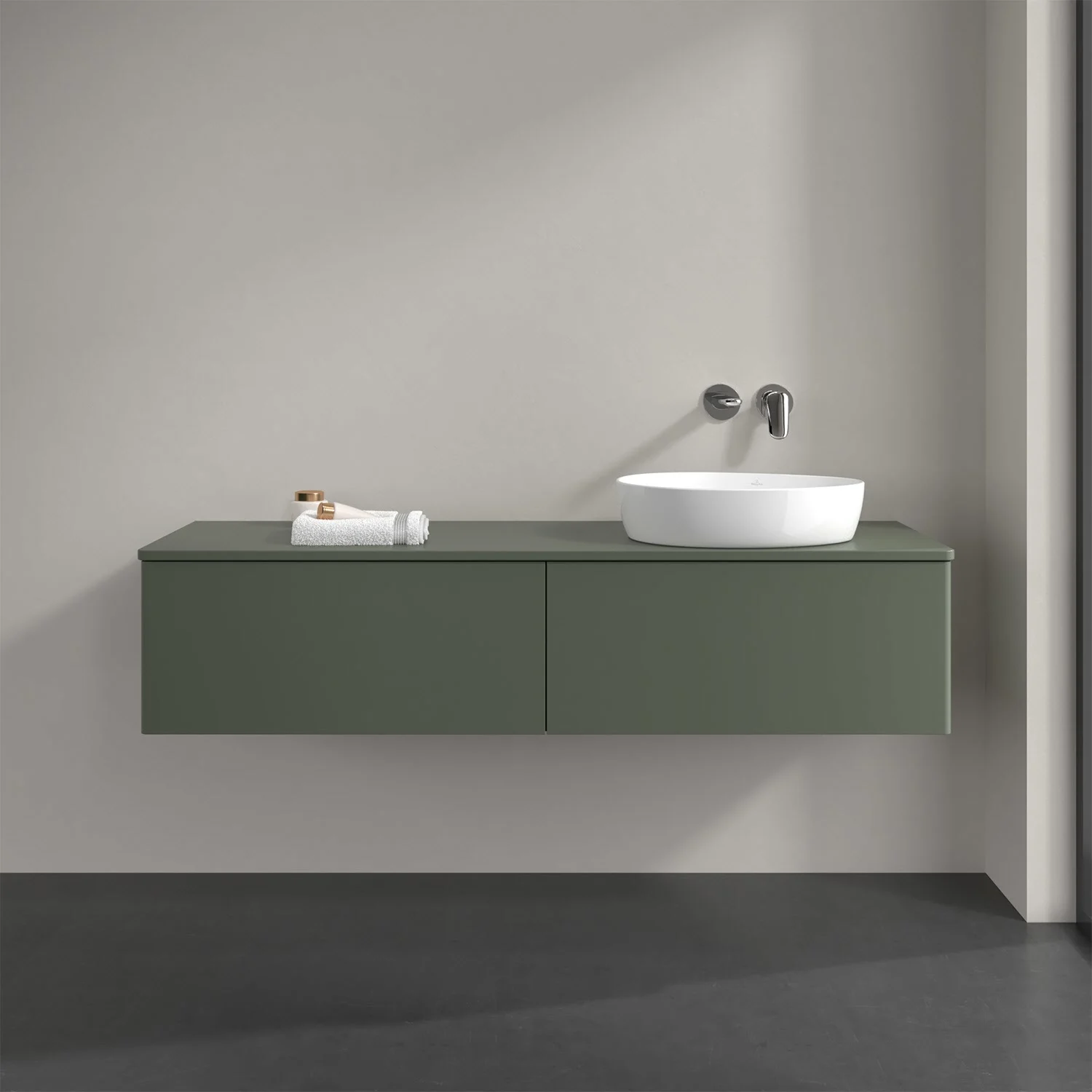 Zielone meble łazienkowe z umywalką na ciemnym blacie, Villeroy & Boch