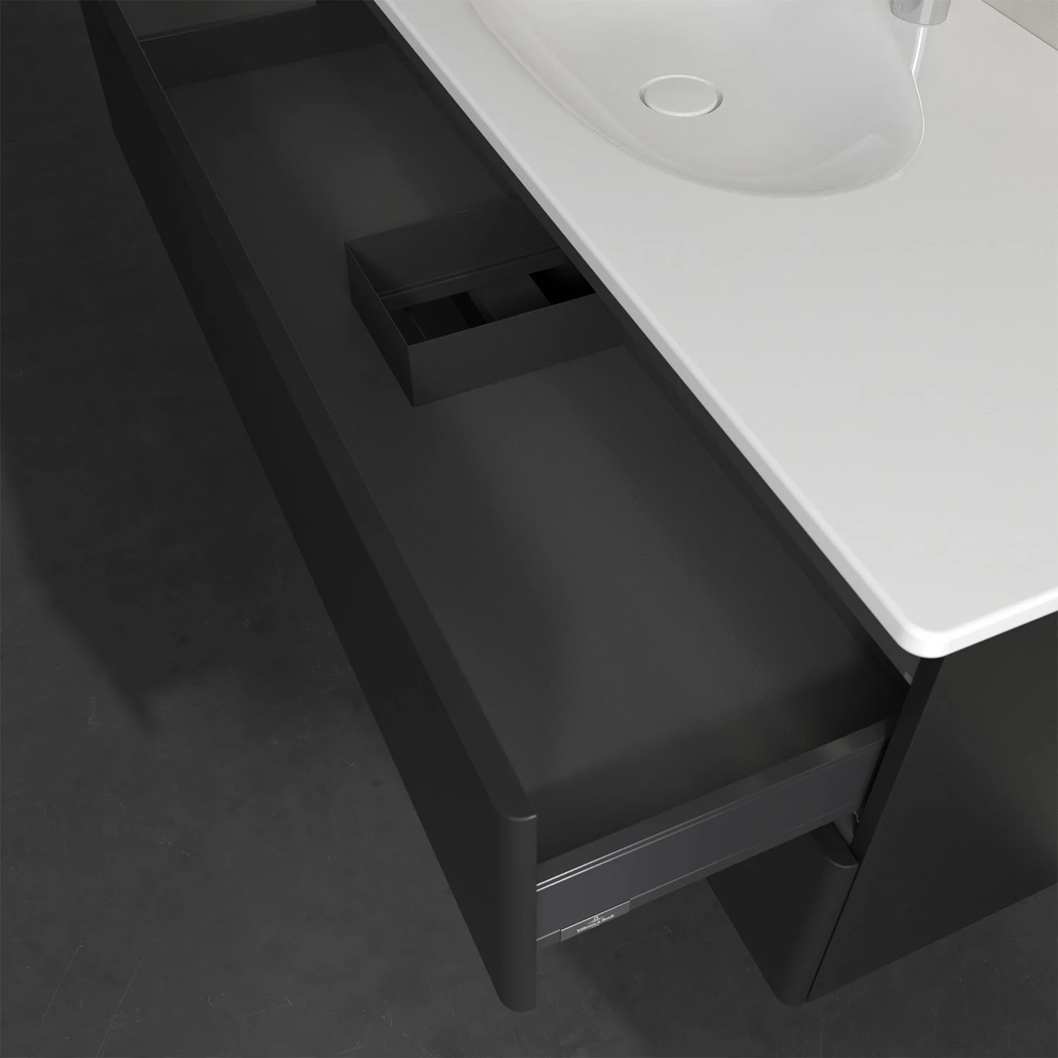 Otwarta szuflada pod czarną umywalką, Villeroy & Boch