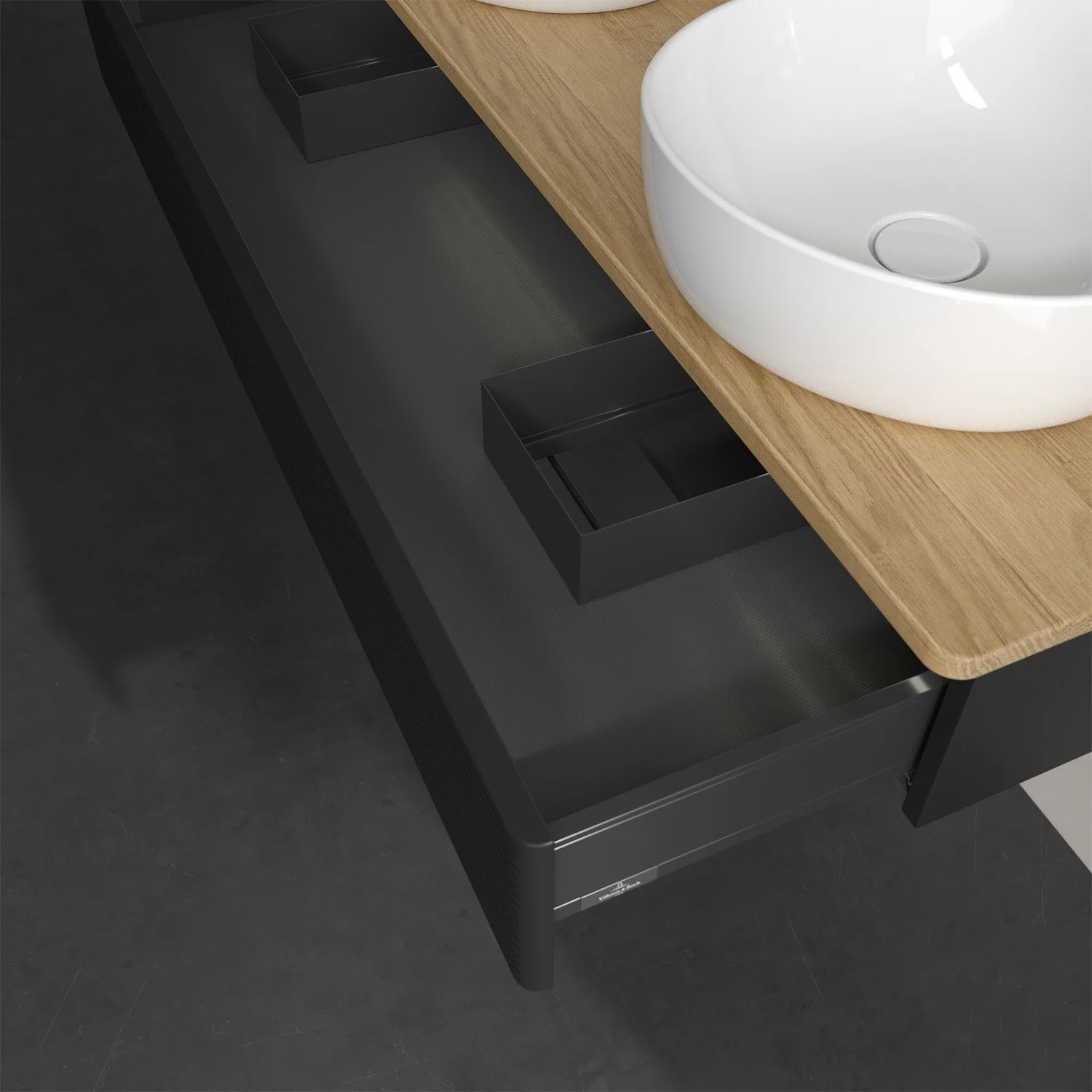 Otwarta szuflada z ciemną powierzchnią i umywalką, Villeroy & Boch