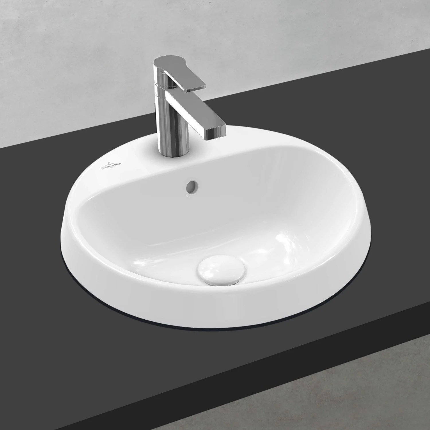 Okrągła umywalka z baterią na ciemnej powierzchni, Villeroy & Boch