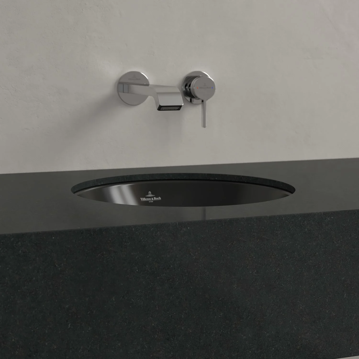 Czarna umywalka z baterią ścienną z bliska, Villeroy & Boch