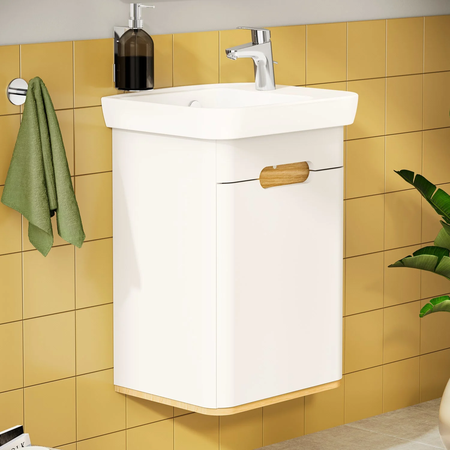 Biała umywalka z baterią na tle żółtej kafelkowej ściany, Vitra