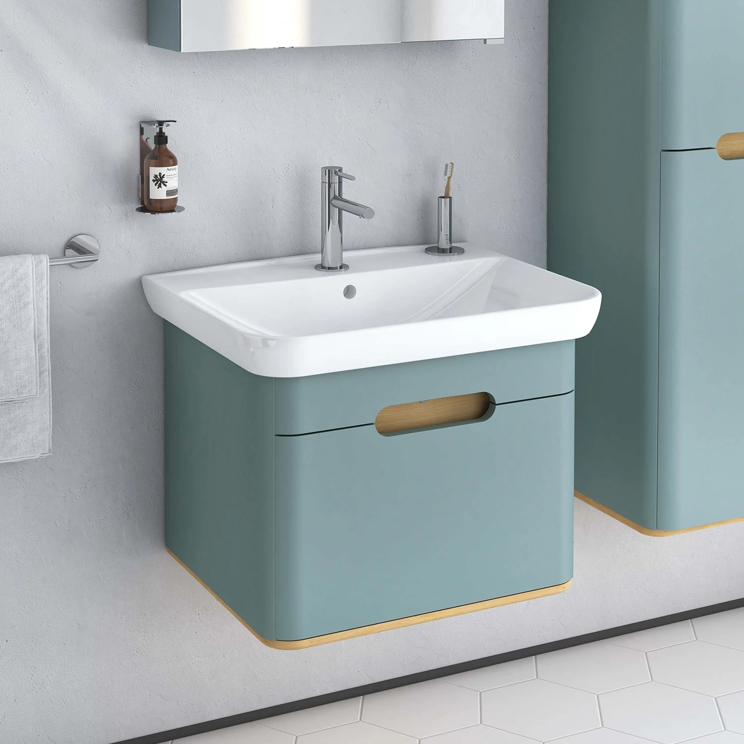 Umywalka z zieloną szafką w łazience, Vitra