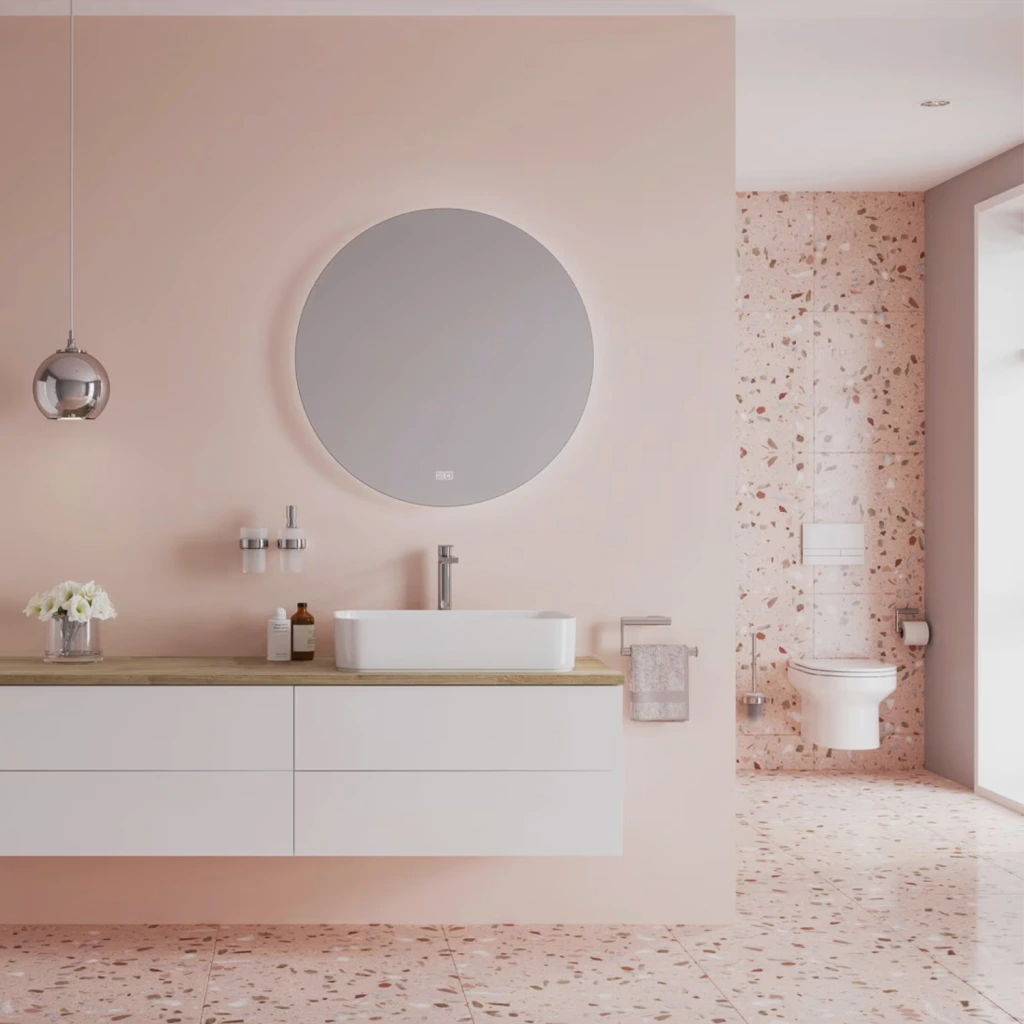 Kronenbach Cube Waschtischkonsole in einem Pastellrosa Badezimmer mit Terrazzoboden.