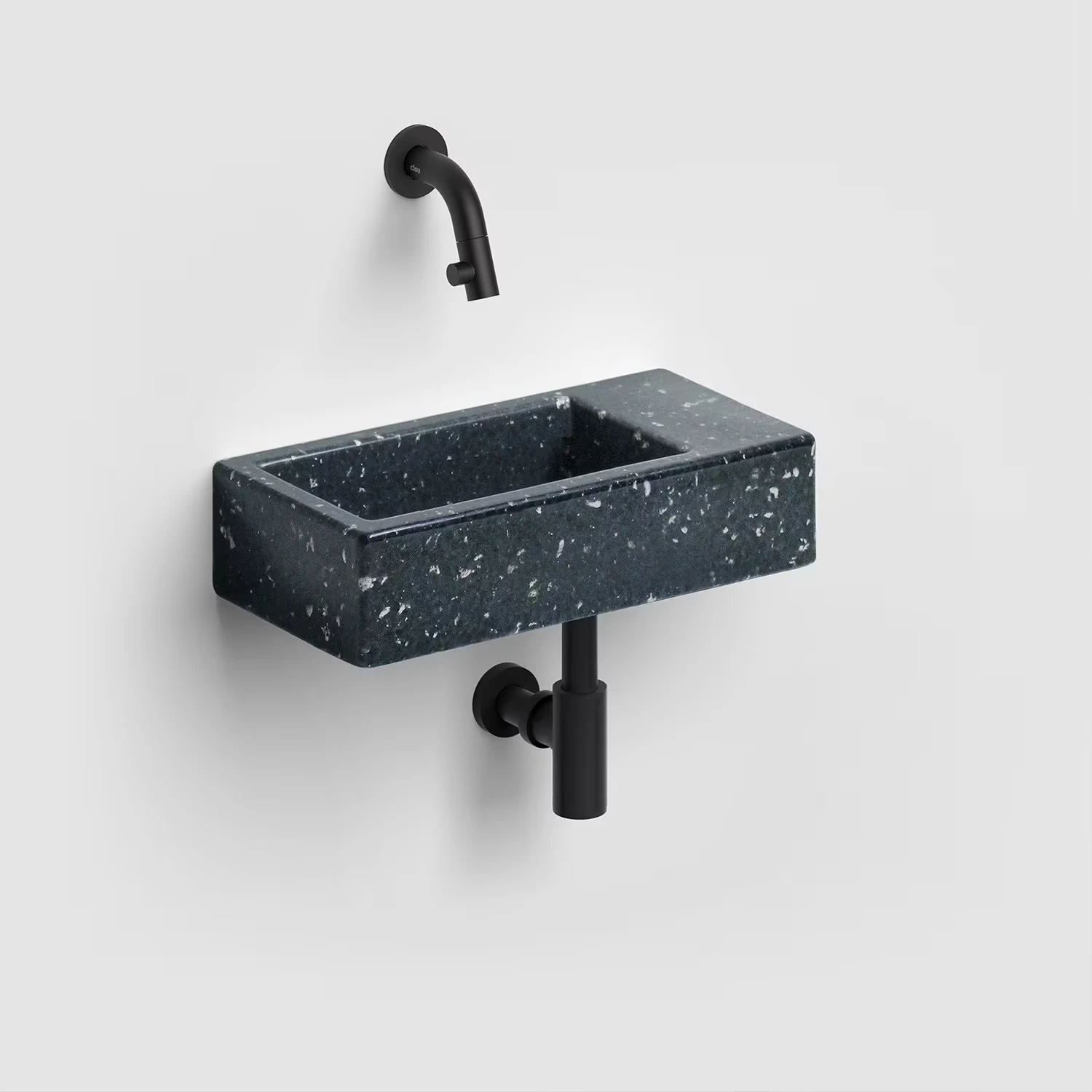 Schwarzes Handwaschbecken mit schwarzer Armatur und Siphon