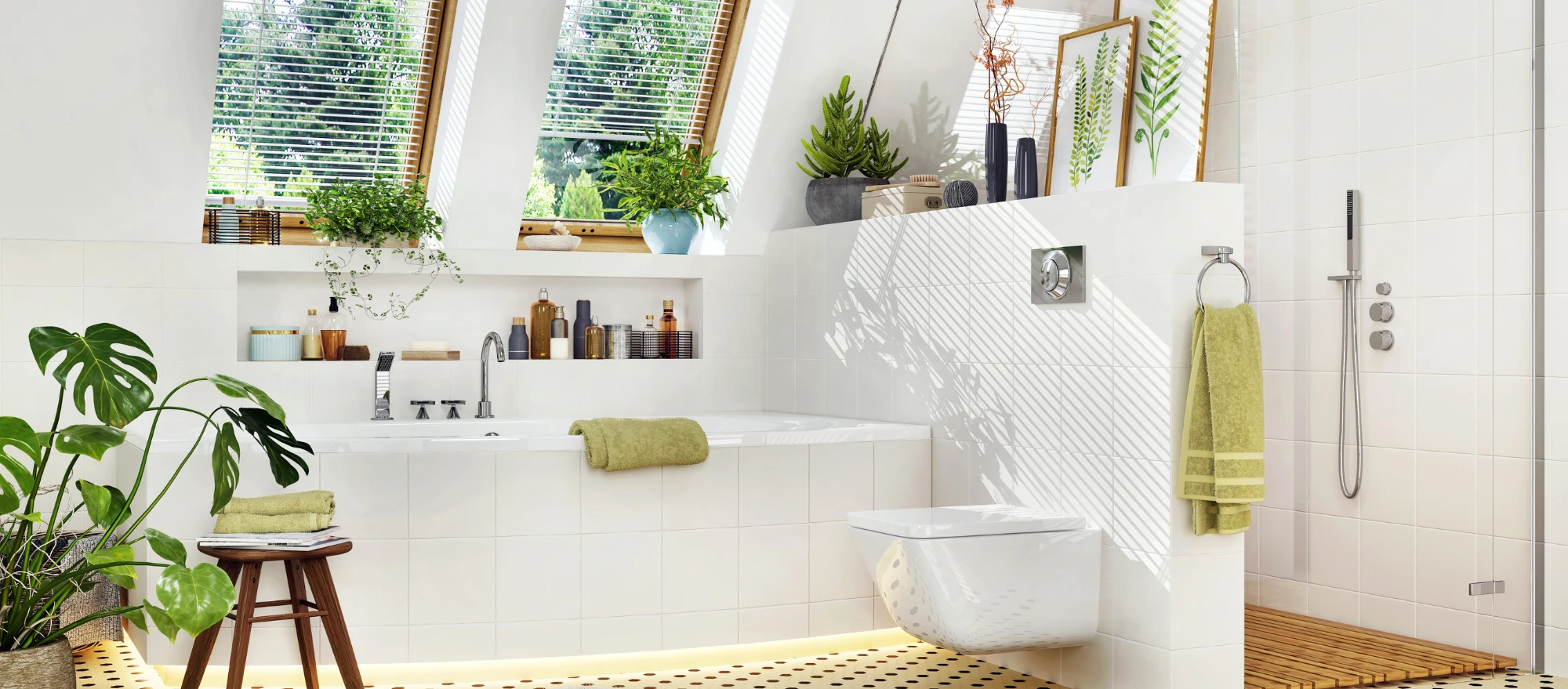 weißes Badezimmer mit grünen Dekoelementen, wie Handtücher und Pflanzen
