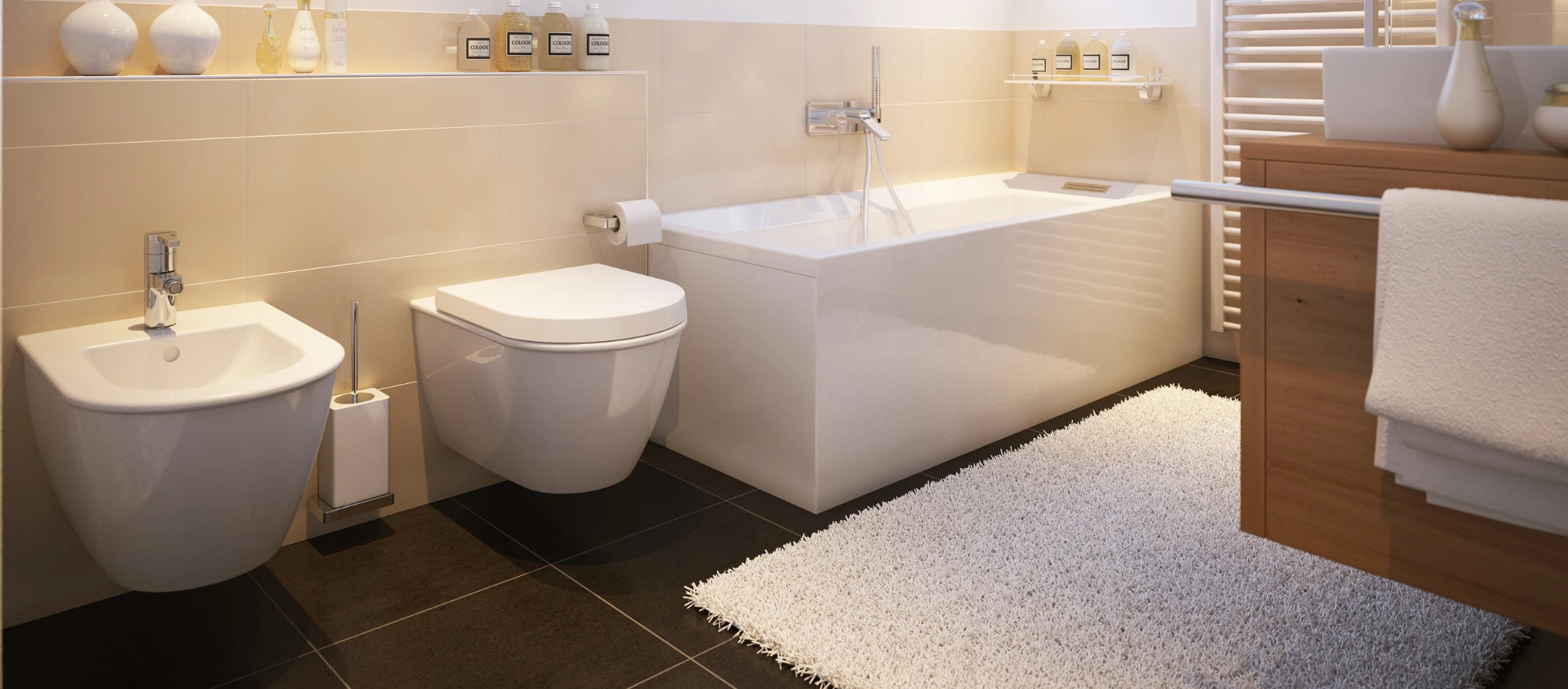 Weißes Wand WC und Bidet in einem hell eingerichtetem, modernen Badezimmer