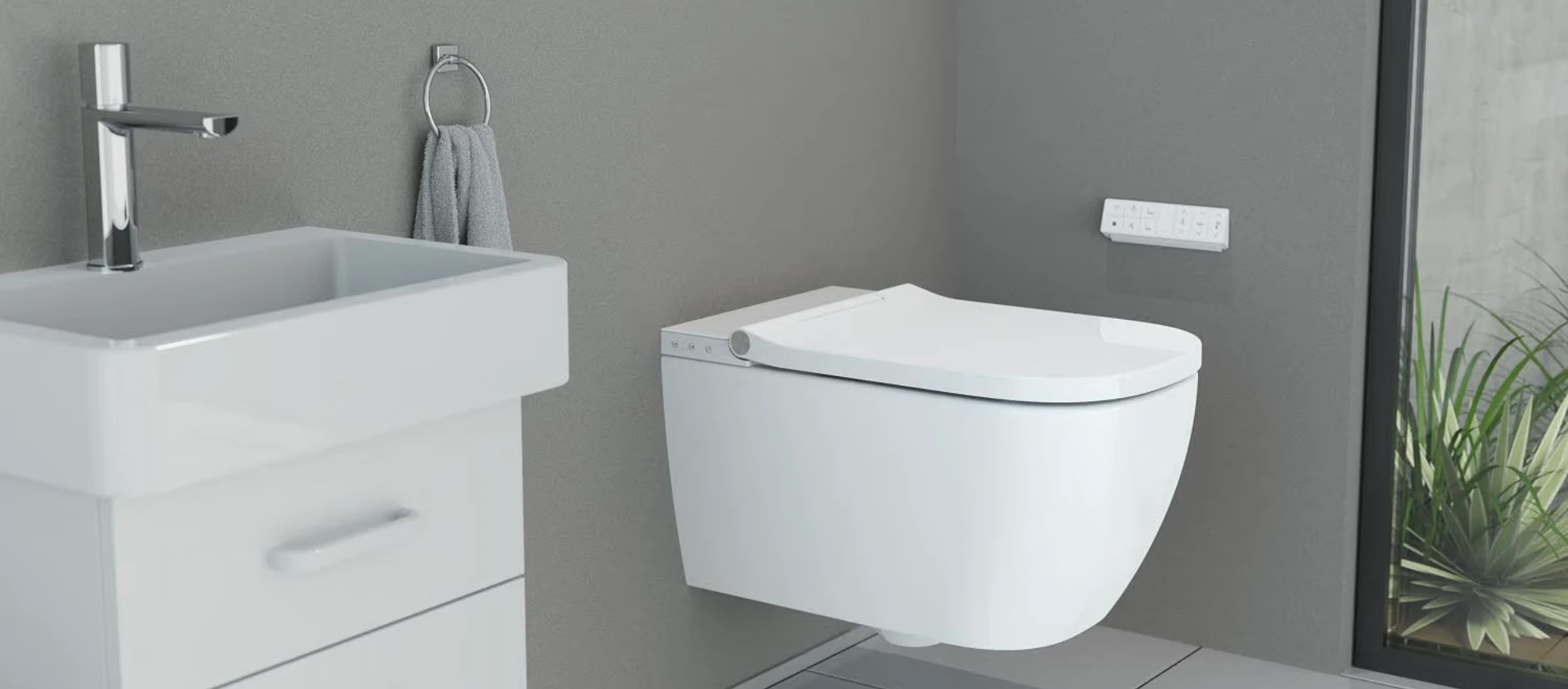Weißes WC in einem grauen Bad
