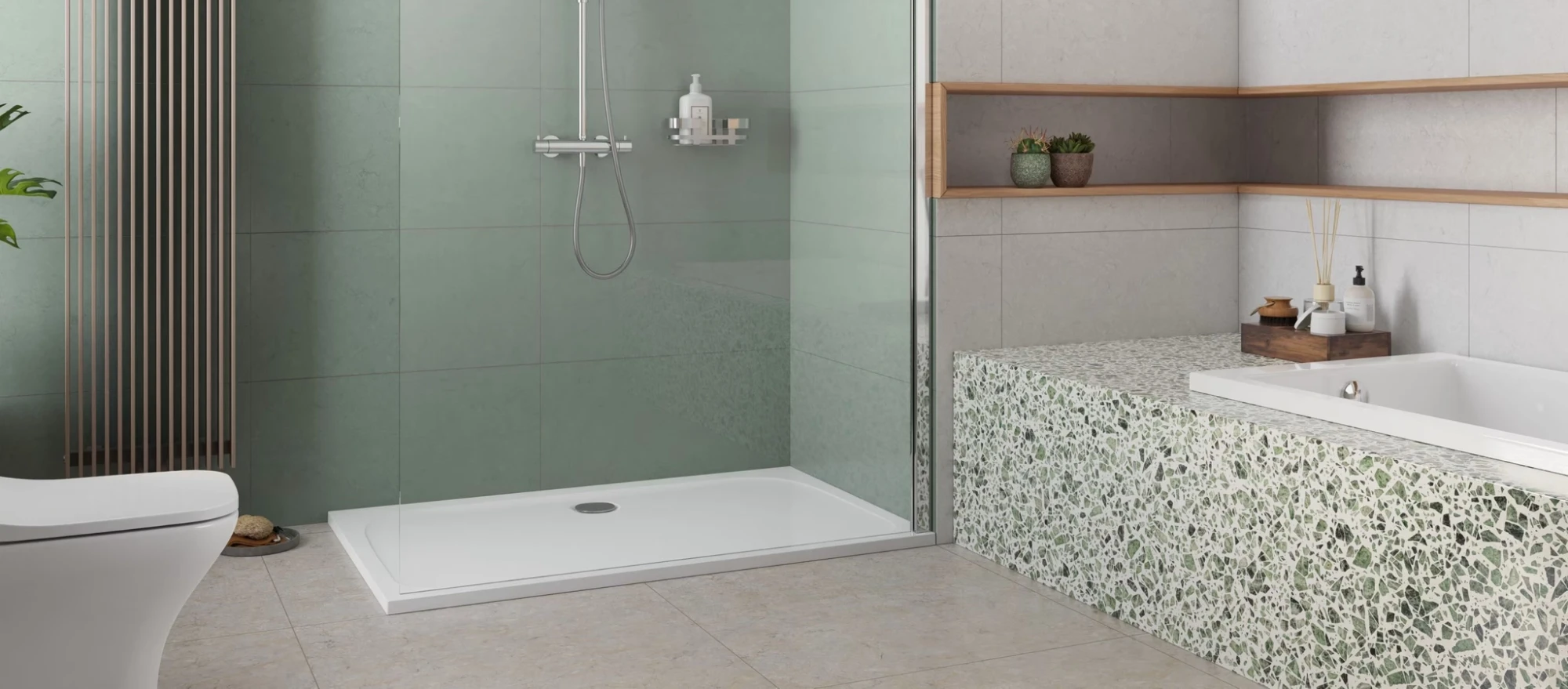 Modernes, hellgrünes Badezimmer mit einer Badewanne in einer Terrazzo-Verkleidung.